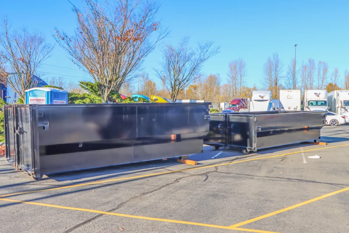 Professional dumpster rental service with roll-off container on residential driveway in Miramar Beach